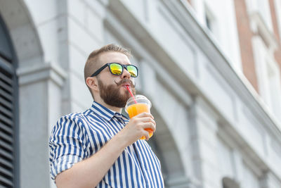 Young man drinking drink