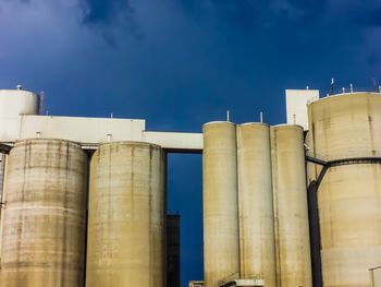 Low angle view of factory against sky