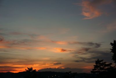 Low angle view of cloudy sky at sunset