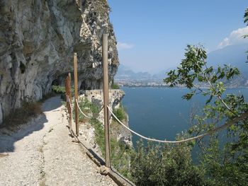 Scenic view of sea and mountains against sky