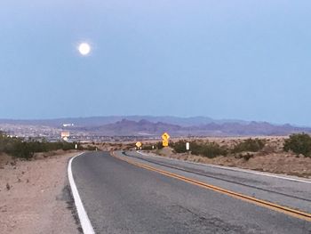 Road against sky at night