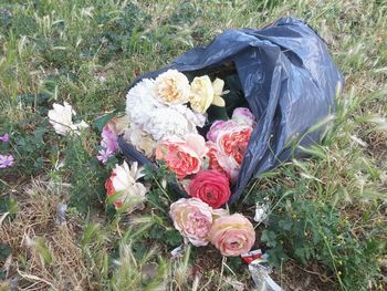 High angle view of rose bouquet on grass