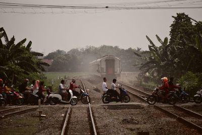 People on railway crossing 