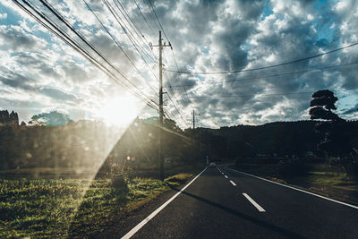 Road against cloudy sky