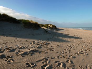 Scenic view of beach against sky