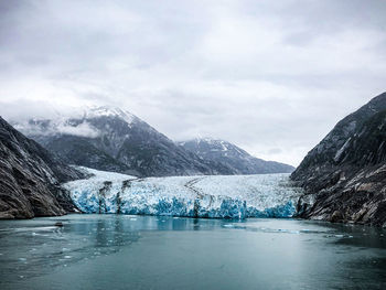 Scenic view of snowcapped mountains against sky at the dawes glacier in alaska 