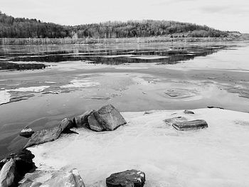 Scenic view of frozen lake against sky