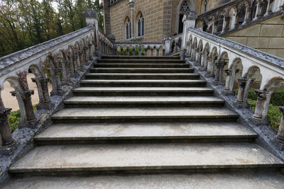 Low angle view of steps amidst buildings