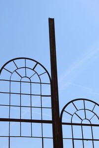 Low angle view of basketball hoop against clear blue sky