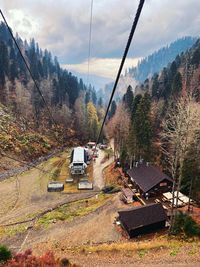 Cars on mountain against sky