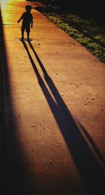 Shadow of people on road