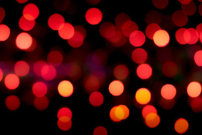 Defocused image of illuminated lights at night