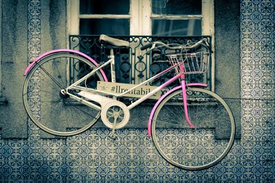 Close-up of bicycle against brick wall