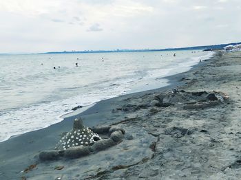 Scenic view of beach against sky