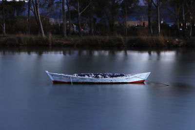 Boat moored in lake