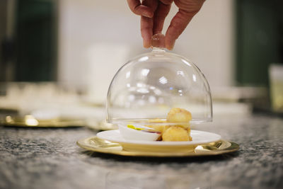 Close-up of hand holding ice cream