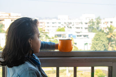 Portrait of woman drinking coffee