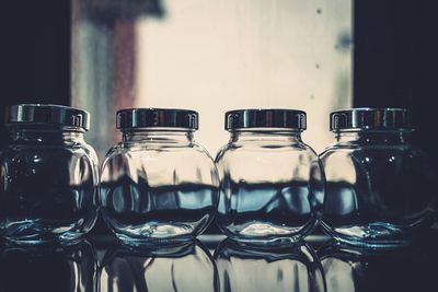 Close-up of empty jars on table