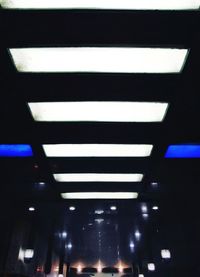 Low angle view of illuminated lights on ceiling