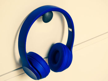 Close-up of electric lamp against blue background