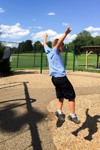 Boy jumping at playground