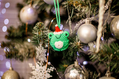 Christmas decorations hanging on tree