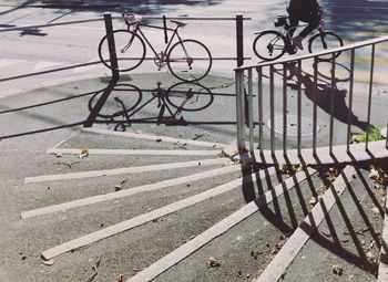 High angle view of bicycle parked on railing