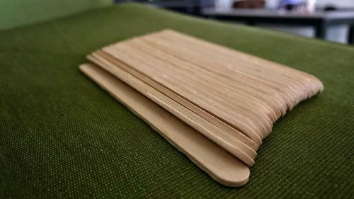 High angle view of wooden sticks on table