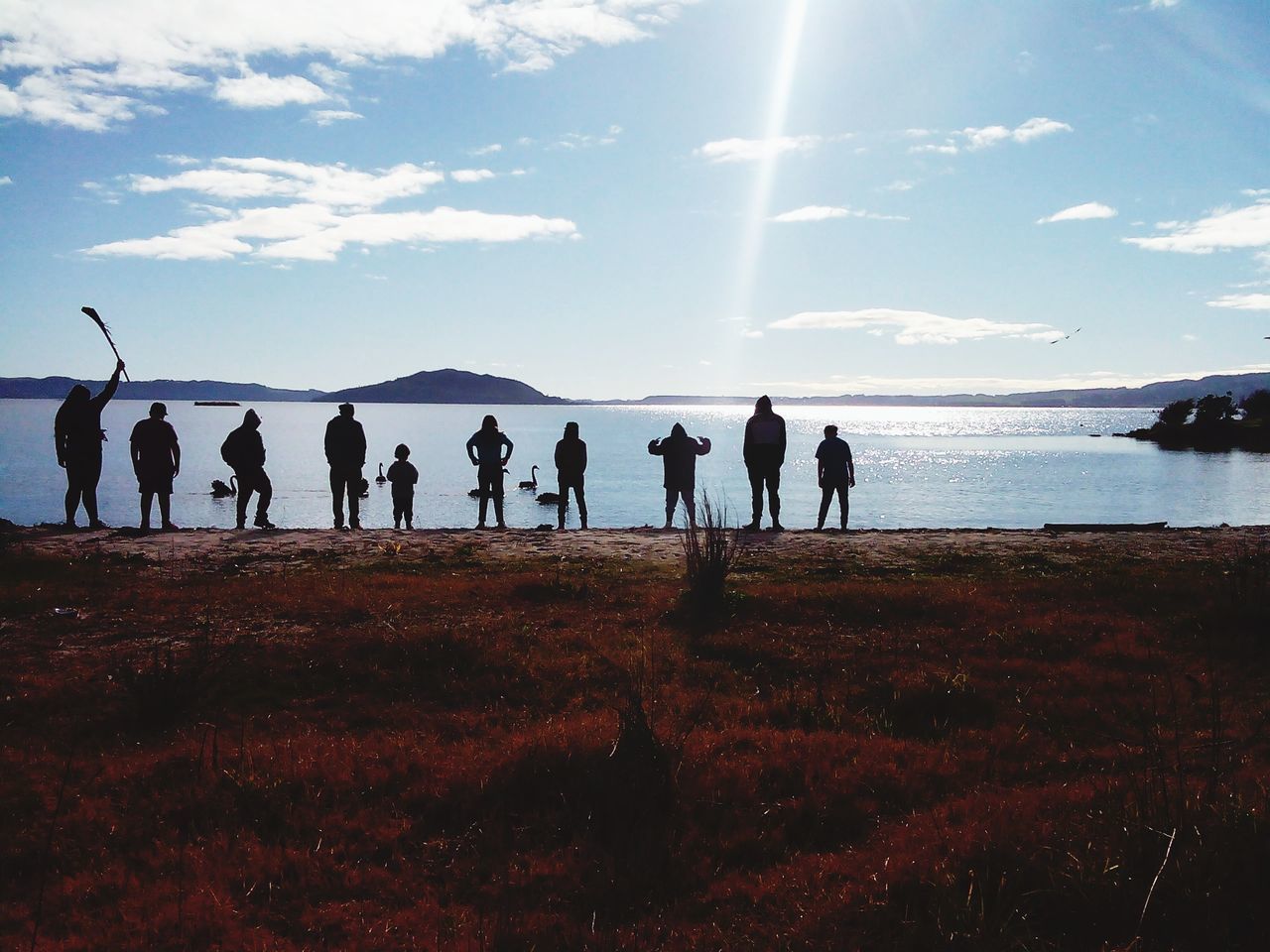 sky, water, large group of people, sea, person, men, leisure activity, lifestyles, cloud - sky, scenics, silhouette, tranquil scene, beauty in nature, nature, beach, horizon over water, standing, tranquility, togetherness