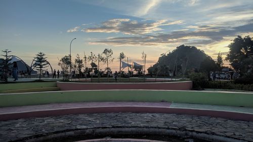 Scenic view of swimming pool against sky at sunset