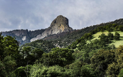 Low angle view of rocky mountain against sky