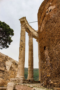 Low angle view of old ruin building against sky