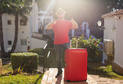 Rear view of man standing in yard