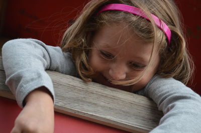 Close-up cute girl sitting on bench