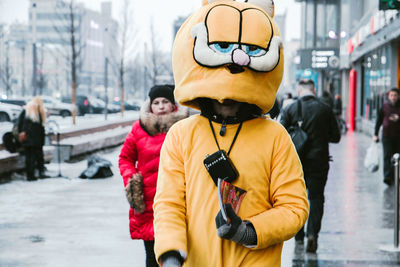 People standing on street in city during winter