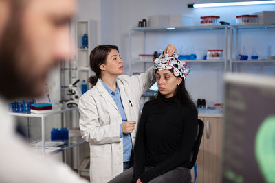 Doctor checking eeg scan of patient