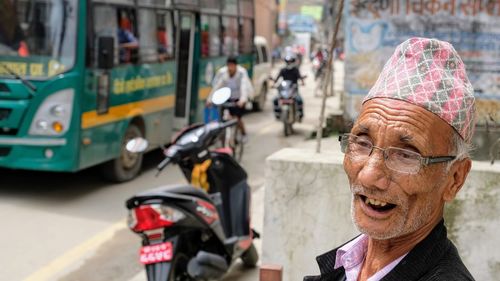 Portrait of man on street in city