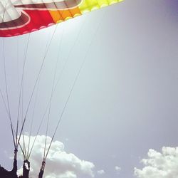 Low angle view of amusement park ride against sky