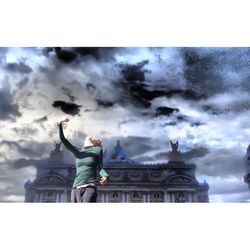 Low angle view of statue against cloudy sky