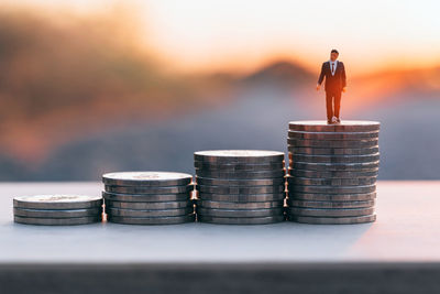 Close-up of coin stack on table