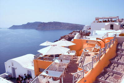 Santorini, greece -cyclades architecture hotels houses and cafes over the caldera in oia