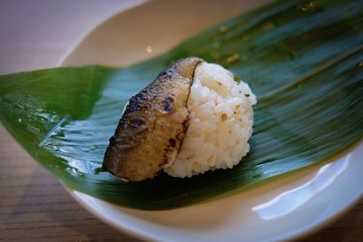 Close-up of sushi served on table