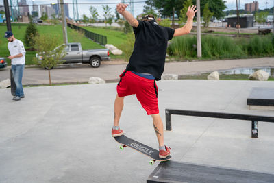 Man skateboarding on skateboard in city