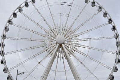 Low angle view of ferris wheel against sky