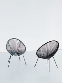 Low angle view of electric lamp against white background