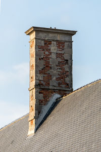 Low angle view of old building against sky