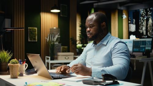 Side view of businessman working at office