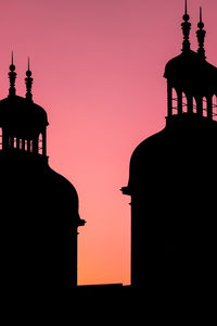 Low angle view of lighthouse against sky during sunset