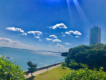 Scenic view of sea and buildings against sky