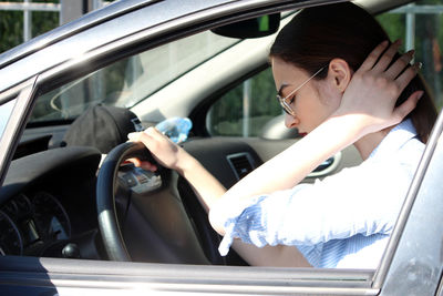 Woman sitting in car